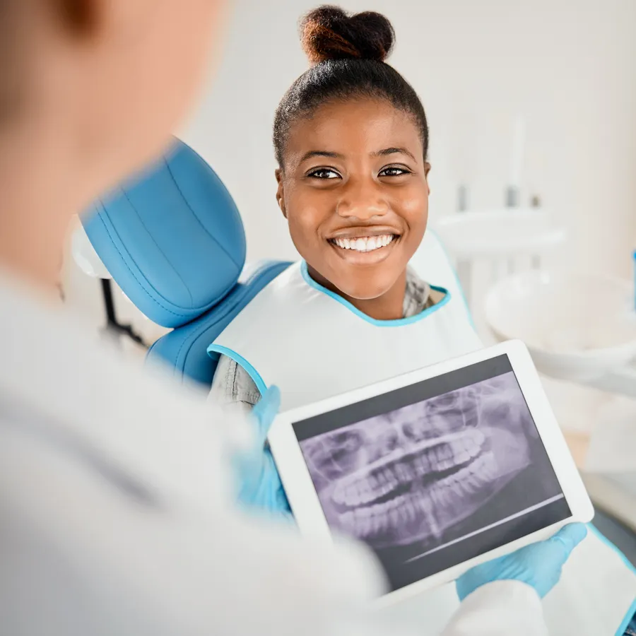 Child smiling during dental visit in Gilbert, AZ