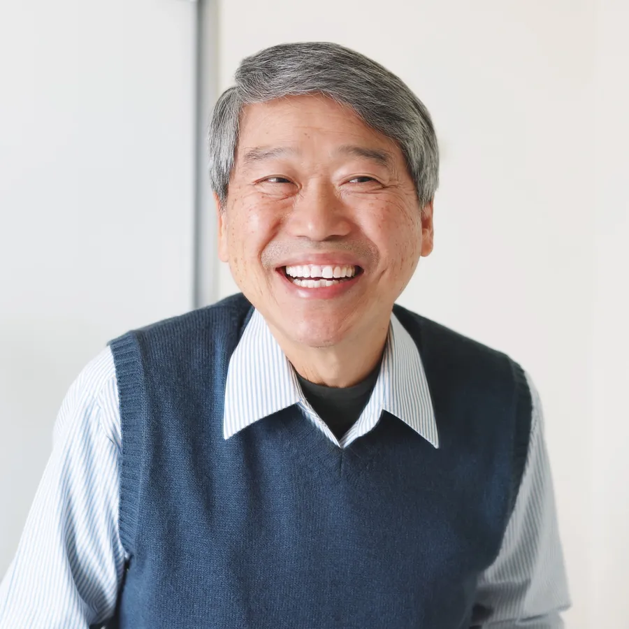 Smiling patient after dental exam and oral cancer screening