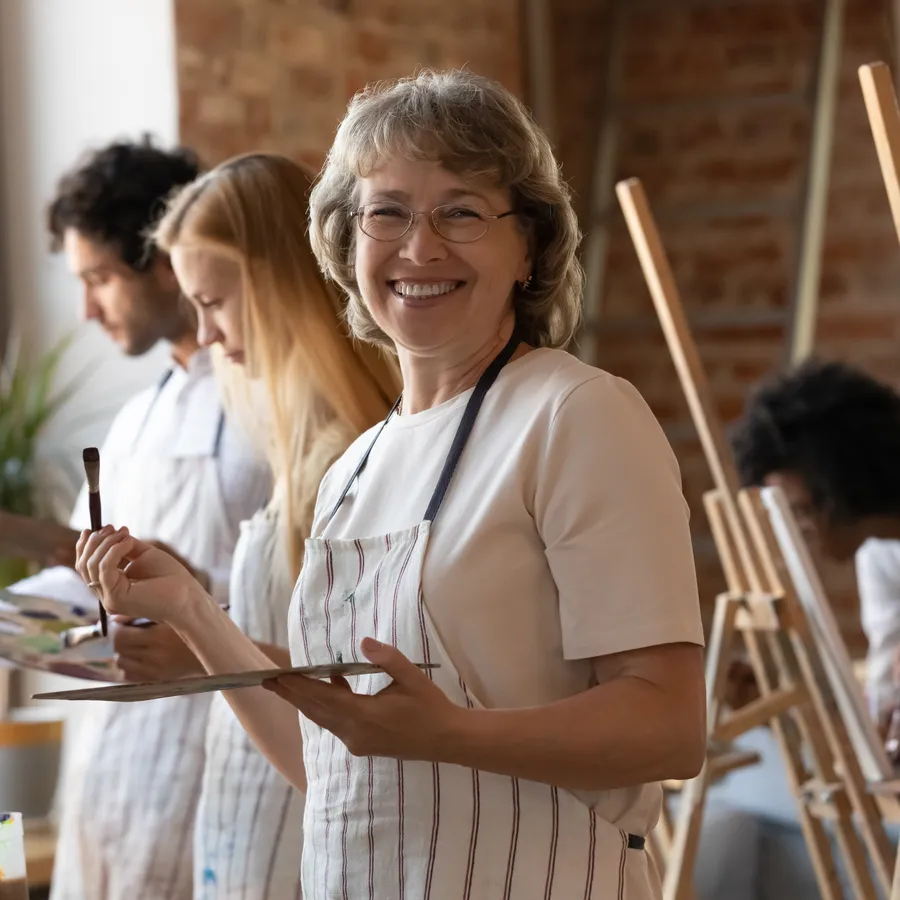 Woman smiling confidently, representing whole-body wellness