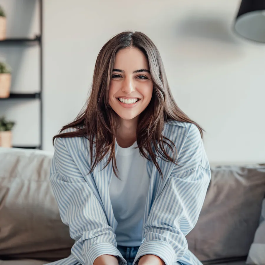 Woman smiling after a preventive dental visit